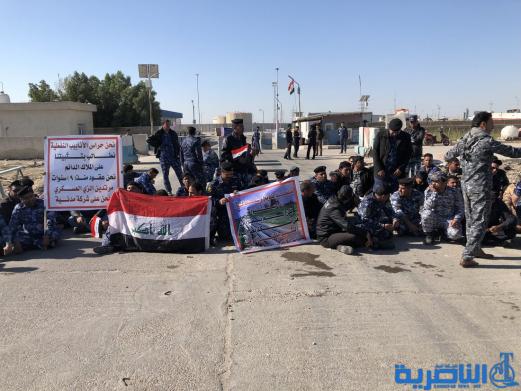 موظفو العقود في حماية الانابيب النفطية يتظاهرون في الناصرية لتثبيتهم على الملاك الدائم - تقرير مصور -