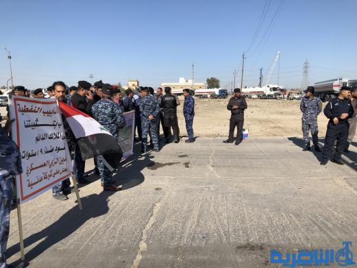 موظفو العقود في حماية الانابيب النفطية يتظاهرون في الناصرية لتثبيتهم على الملاك الدائم - تقرير مصور -