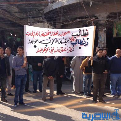  اصحاب المتاجر في الحبوبي يتظاهرون للمطالبة بقانون يكبح ارتفاع الايجارات - تقرير مصور -