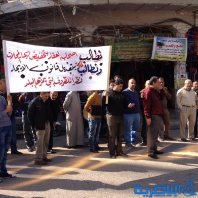  اصحاب المتاجر في الحبوبي يتظاهرون للمطالبة بقانون يكبح ارتفاع الايجارات - تقرير مصور -