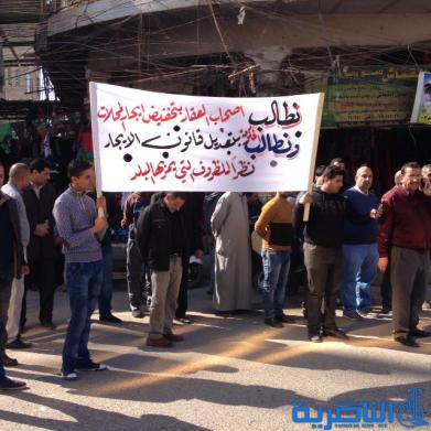  اصحاب المتاجر في الحبوبي يتظاهرون للمطالبة بقانون يكبح ارتفاع الايجارات - تقرير مصور -