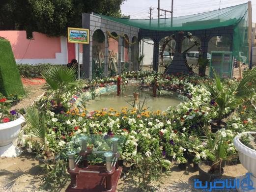 بالصور...محافظ ذي قار ووزيرة الاعمار يفتتحان معرض الزهور الثالث في الناصرية