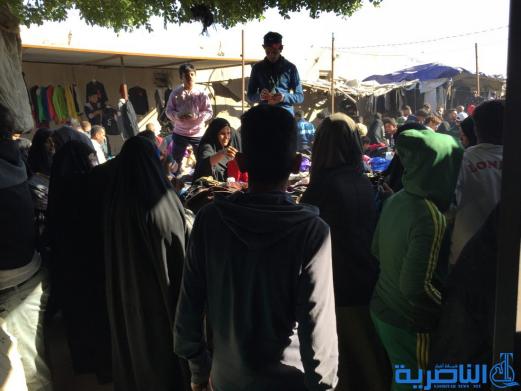 بالصور : سوق البالة يكسو فقراء الناصرية بدفيء الملابس ورخيصها ، والصحة تحذر