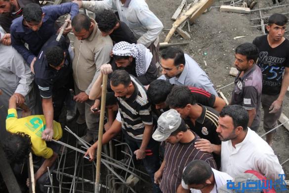الدفاع المدني ينتشل جثتي عاملي البناء من تحت انفاض المجلس البلدي في الناصرية - تقرير مصور - 