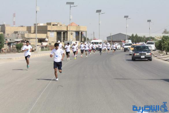 احتفاء بيوم الرياضة ، الناصرية تقيم مارثونا رياضيا بمشاركة 150 متسابقا - تقرير مصور -
