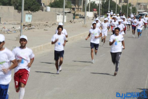 احتفاء بيوم الرياضة ، الناصرية تقيم مارثونا رياضيا بمشاركة 150 متسابقا - تقرير مصور -