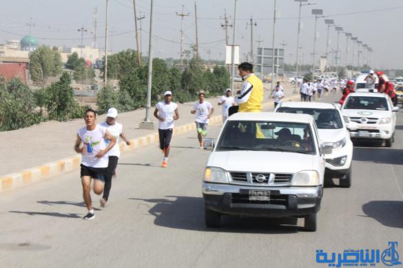 احتفاء بيوم الرياضة ، الناصرية تقيم مارثونا رياضيا بمشاركة 150 متسابقا - تقرير مصور -