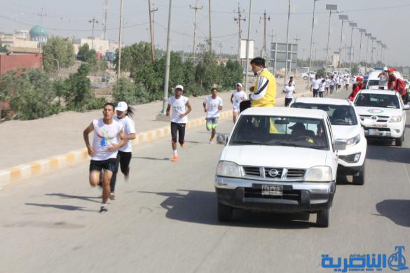 احتفاء بيوم الرياضة ، الناصرية تقيم مارثونا رياضيا بمشاركة 150 متسابقا - تقرير مصور -