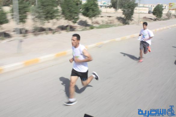 احتفاء بيوم الرياضة ، الناصرية تقيم مارثونا رياضيا بمشاركة 150 متسابقا - تقرير مصور -