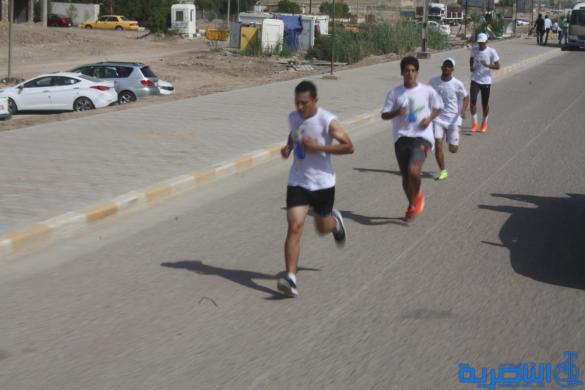 احتفاء بيوم الرياضة ، الناصرية تقيم مارثونا رياضيا بمشاركة 150 متسابقا - تقرير مصور -