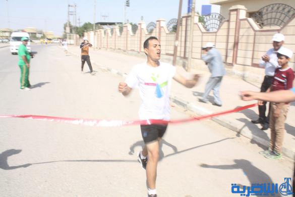 احتفاء بيوم الرياضة ، الناصرية تقيم مارثونا رياضيا بمشاركة 150 متسابقا - تقرير مصور -