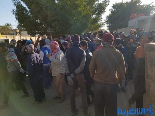 العشرات من عمال بلدية الناصرية يتظاهرون للمطالبة باطلاق رواتبهم المتاخرة - تقرير مصور -