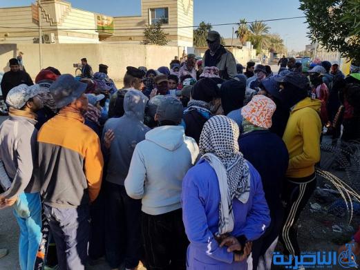 العشرات من عمال بلدية الناصرية يتظاهرون للمطالبة باطلاق رواتبهم المتاخرة - تقرير مصور -