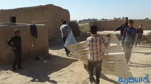 بالصور :خلاف عشائري يدفع بمعلمين وطلبة لبناء مدرسة خاصة بهم من الطين في ذي قار