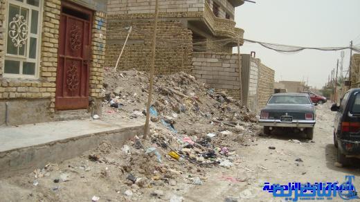 وسط صمت البلدية ، دخان النفايات المحترقة في شارع ابراهيم الخليل يخنق الناصرية