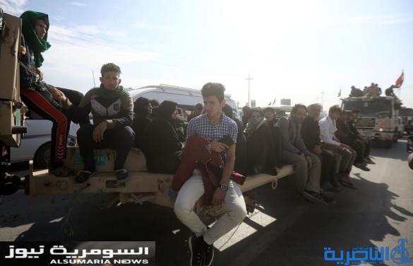 بالصور.. عربات عسكرية تتزاحم لنقل زوار الأربعينية