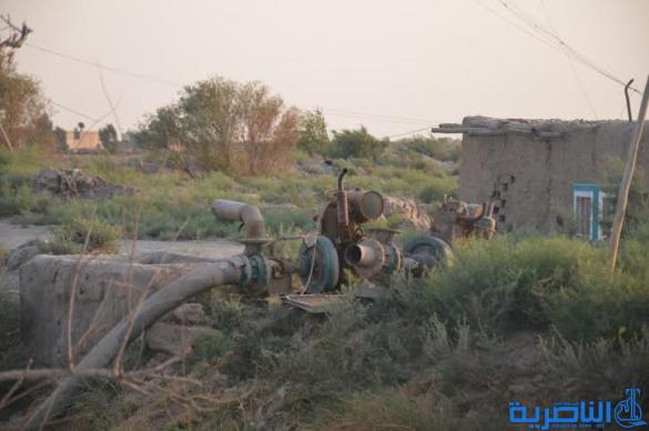  بالصور : الجفاف يحول انهار ذي قار الى ساحات لكرة القدم