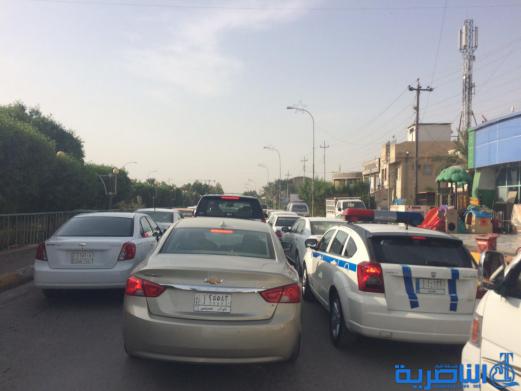  بالصور : اعمال صيانة تتسبب بزحمة مرور خانقة قرب مجلس ذي قار