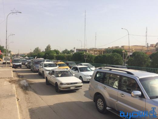  بالصور : اعمال صيانة تتسبب بزحمة مرور خانقة قرب مجلس ذي قار
