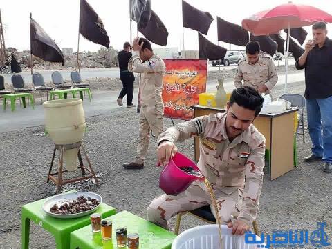 بالصور:موكب حسيني لقاعدة الامام علي الجوية خدمة لزوار الاربعين 